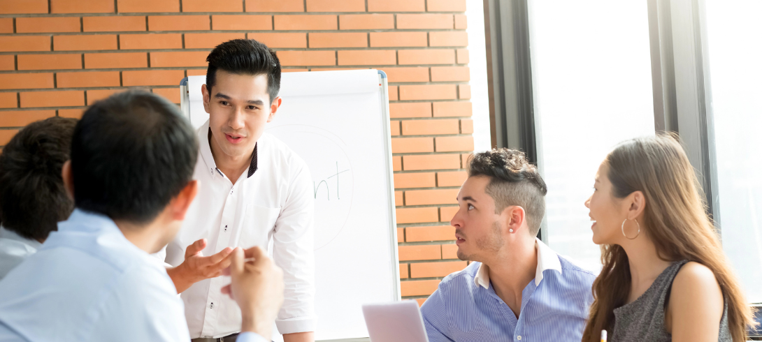 A person leading a group meeting.